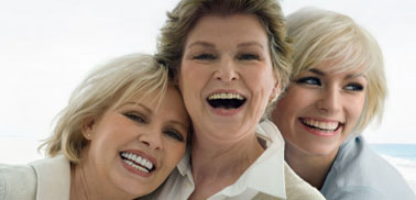 Three women smiling
